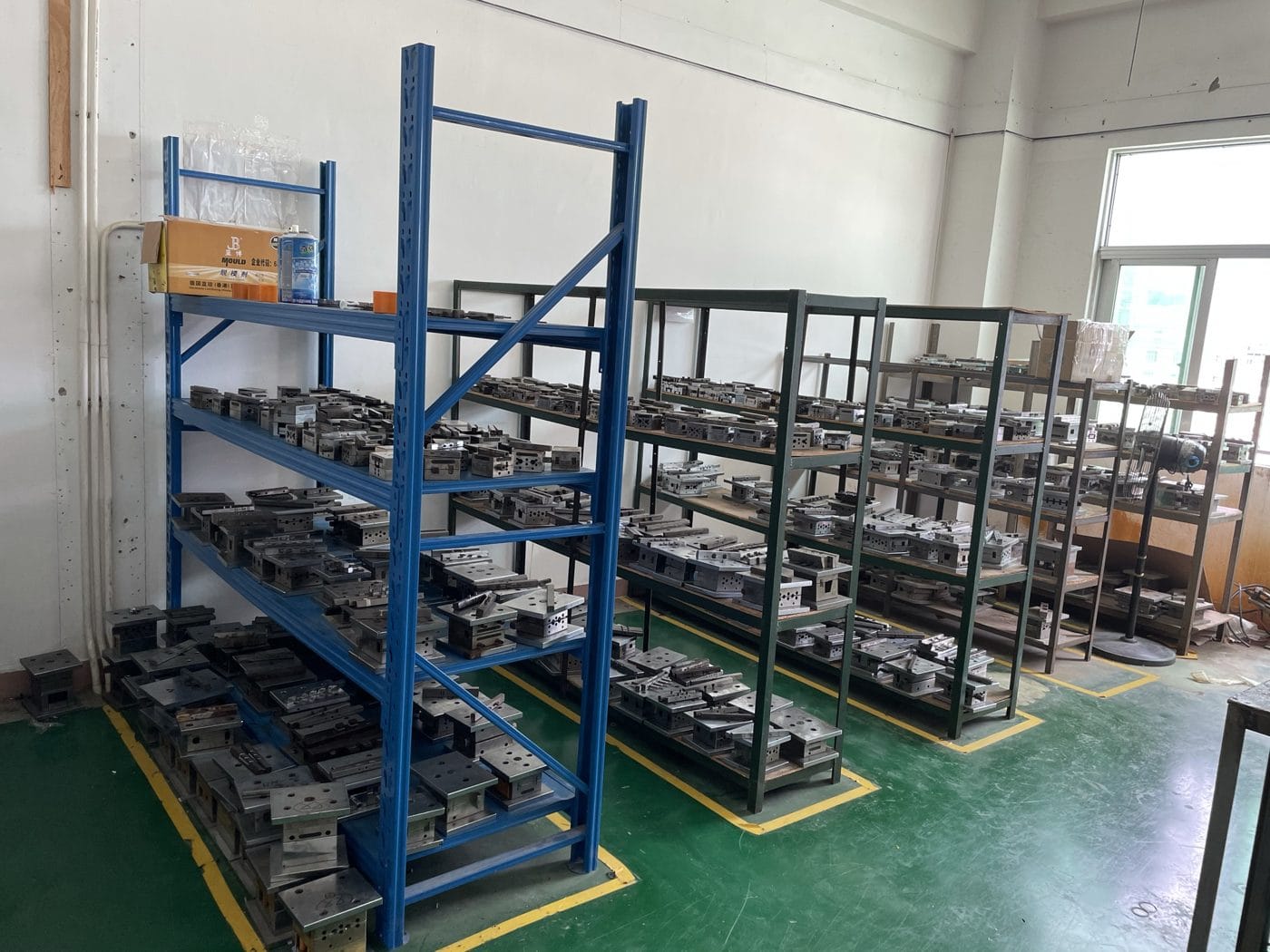 in-house overmold tooling stored in racks at our Shenzhen factory